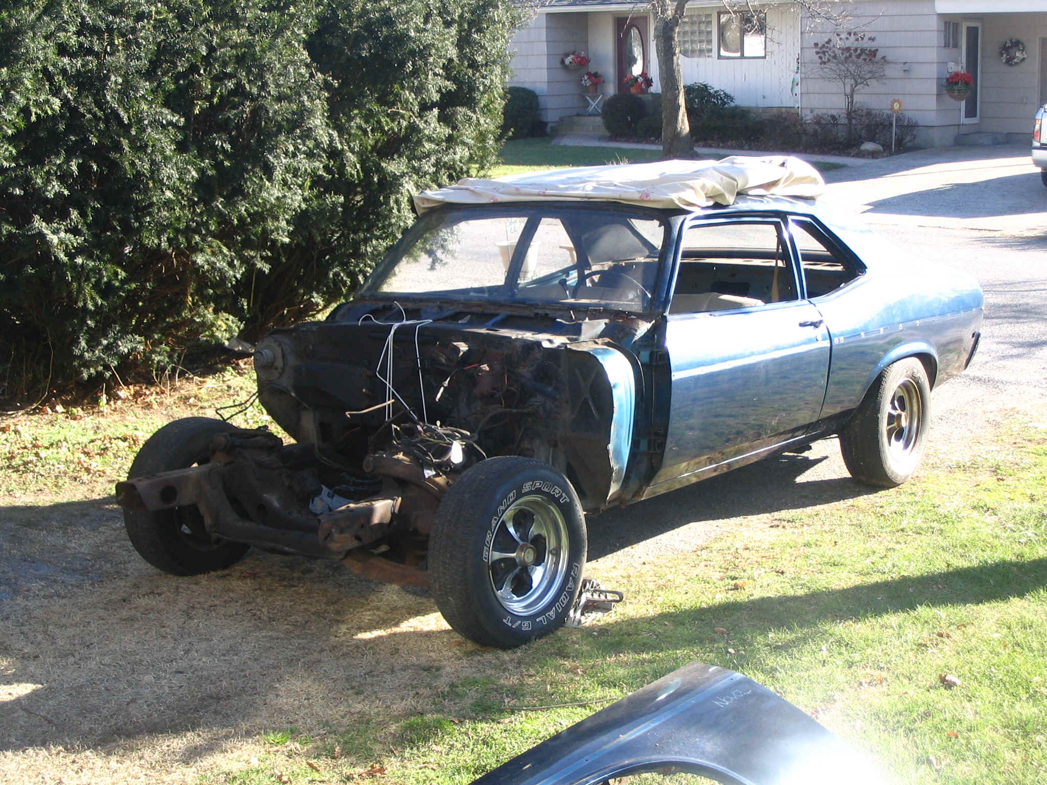 Engine bay stripped to bare metal