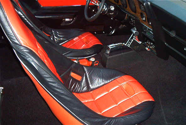 Interior — red and black quilted seats